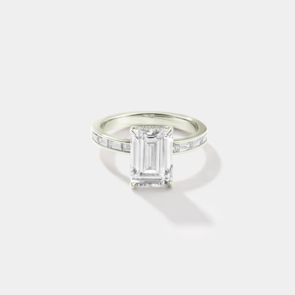 Emerald-cut lab-grown diamond engagement ring with a hidden halo and channel-set band in white gold