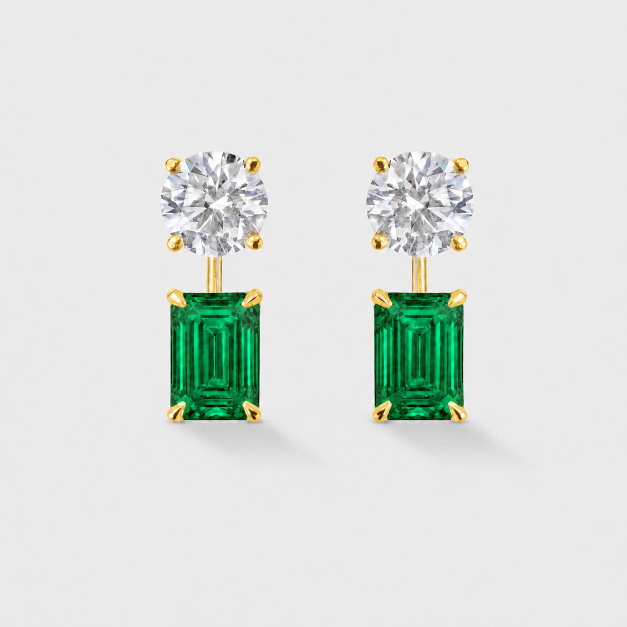 Removable emerald-cut lab-grown emerald earring jackets designed to pair with diamond studs.