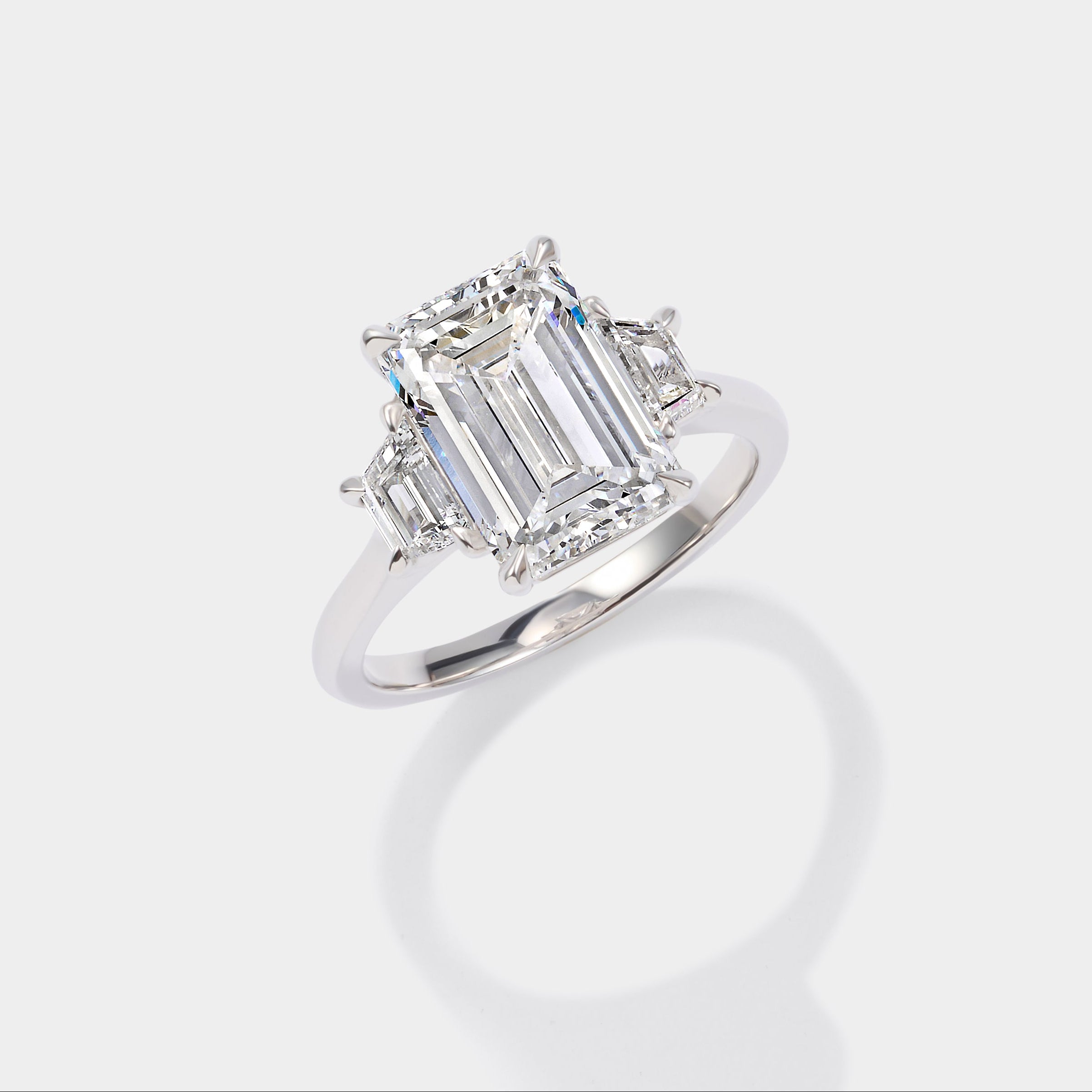 Emerald cut three stone lab-grown diamond engagement ring in 14K yellow gold by Cove Fine Jewelry