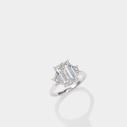 Emerald cut three stone lab-grown diamond engagement ring in 14K yellow gold by Cove Fine Jewelry