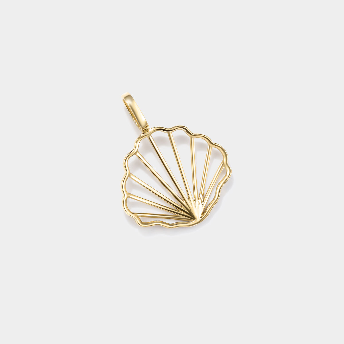 14K gold seashell charm featuring a classic scallop shell design