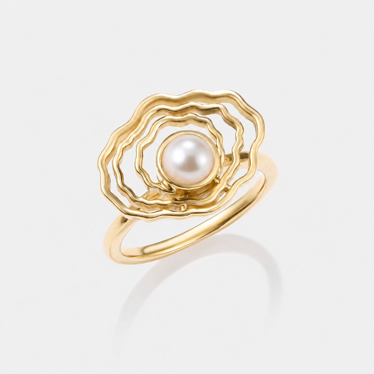 Angled view of our oyster gold pearl ring
