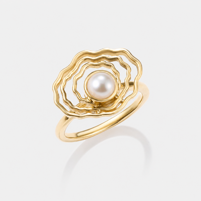 Angled view of our oyster gold pearl ring
