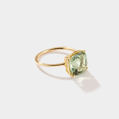 Close-up of cushion cut green amethyst parasolite gemstone set in solid 14k gold statement ring
