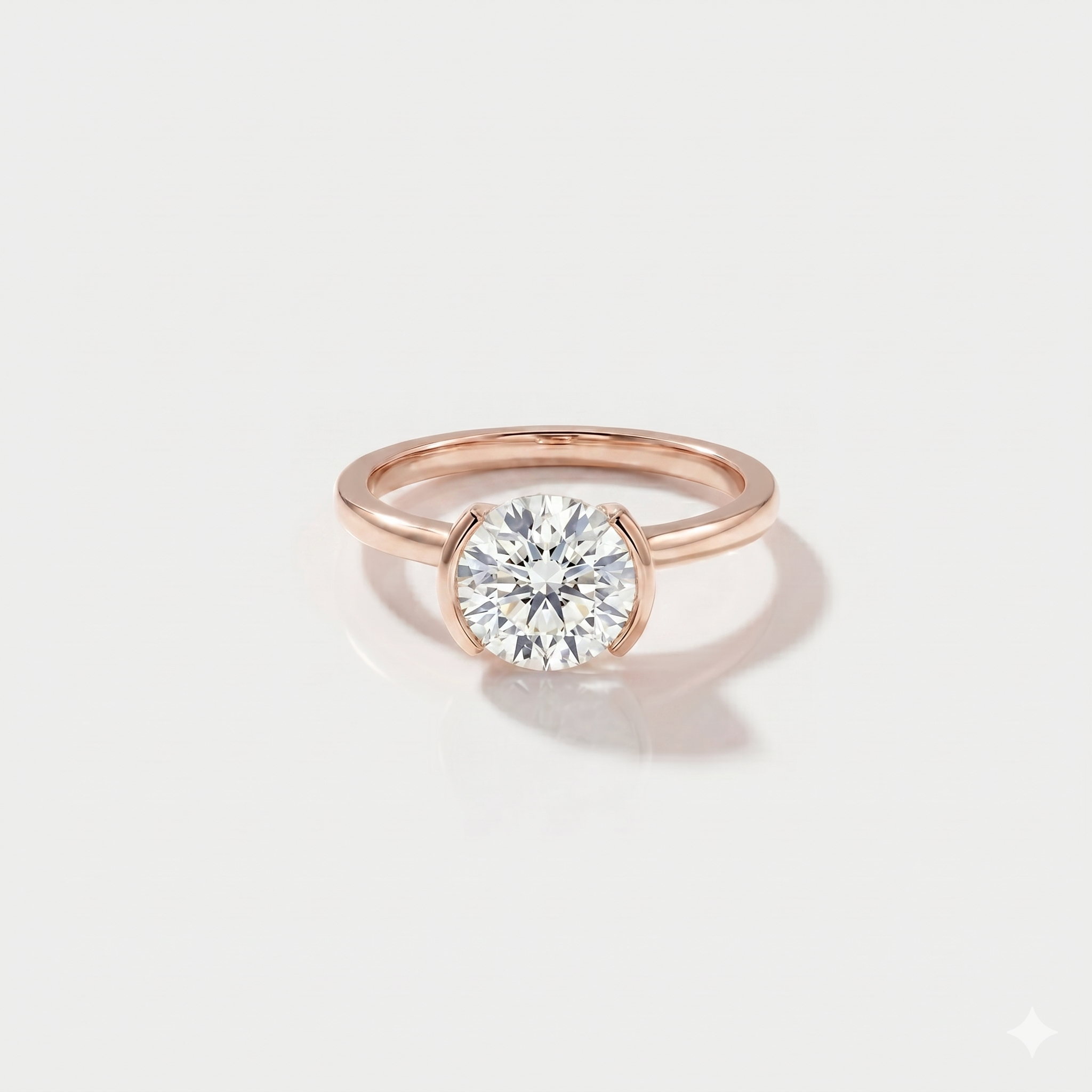 Round half bezel solitaire lab-grown diamond engagement ring in 14K rose gold. 
