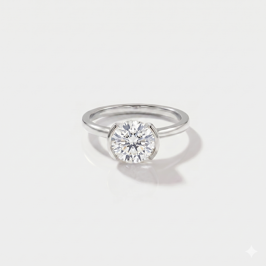 Round half bezel solitaire lab-grown diamond engagement ring in 14K white gold. 
