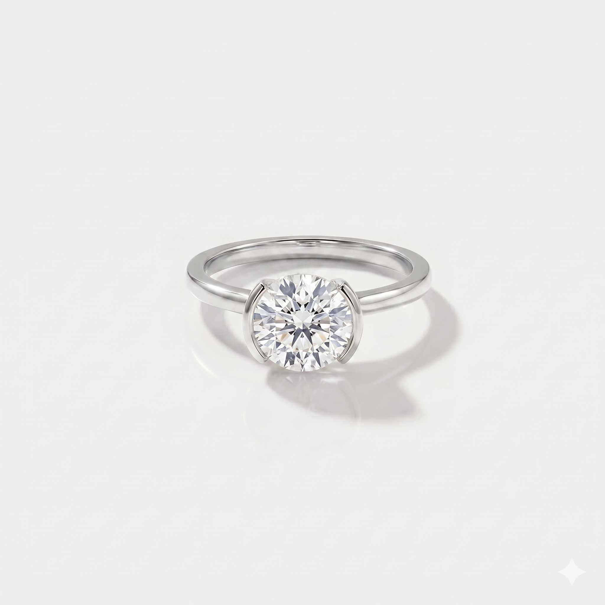 Round half bezel solitaire lab-grown diamond engagement ring in 14K white gold. 
