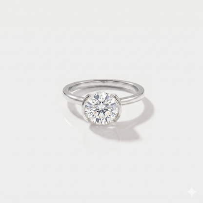 Round half bezel solitaire lab-grown diamond engagement ring in 14K white gold. 
