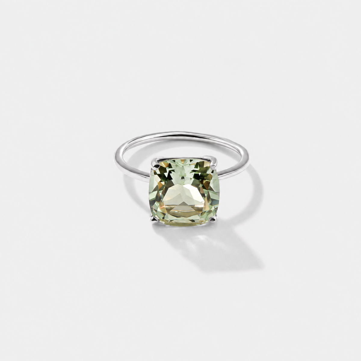 Large cushion-cut green amethyst ring set in polished 14K white gold.