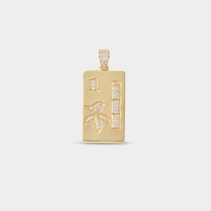 Diamond mahjong pendant necklace photographed on neutral background for luxury jewelry campaign