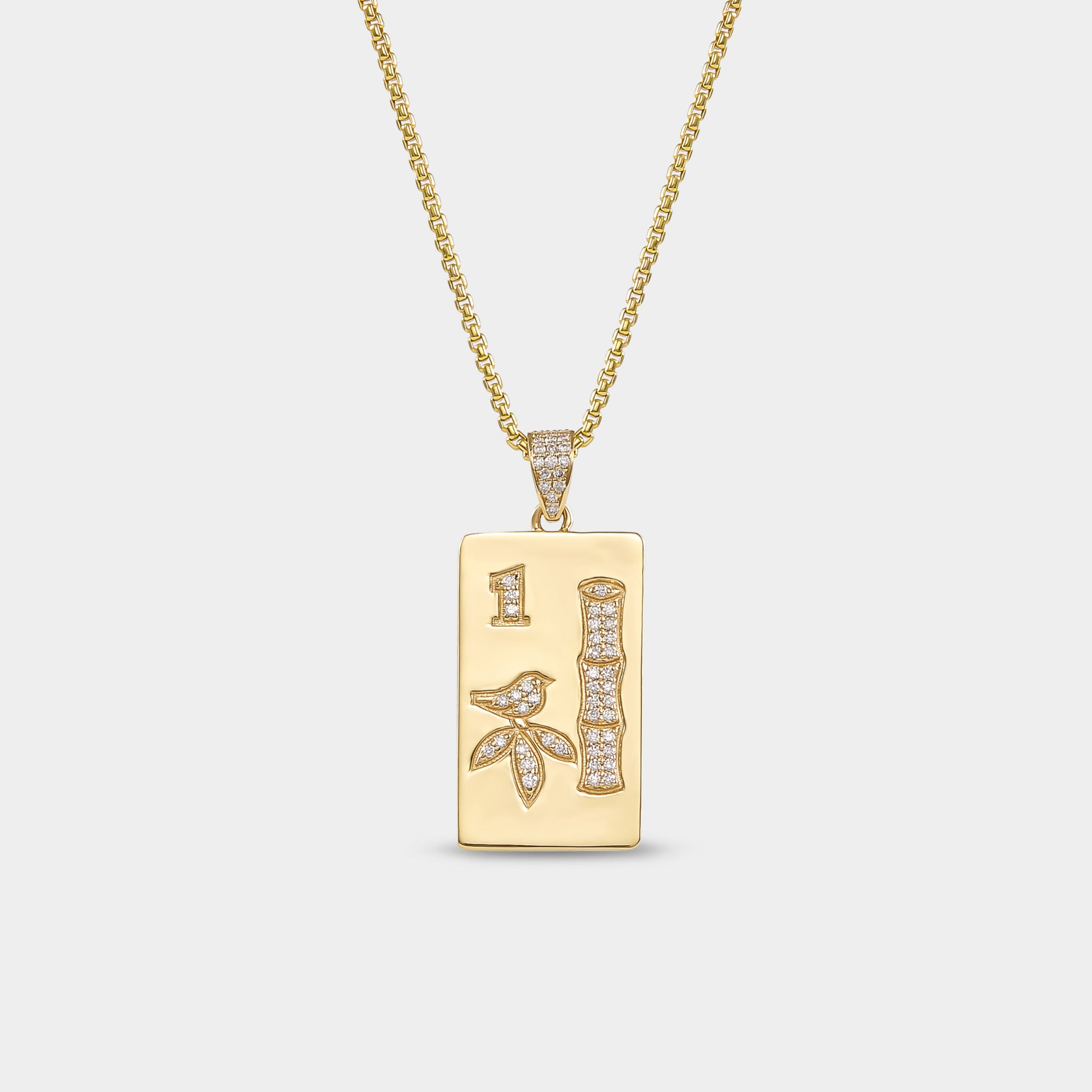 Solid gold mahjong tile pendant with colorful enamel inspired by luxury mahjong accessories