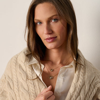 Model wearing our 14K gold oyster pearl necklace layered with our oyster diamond necklace
