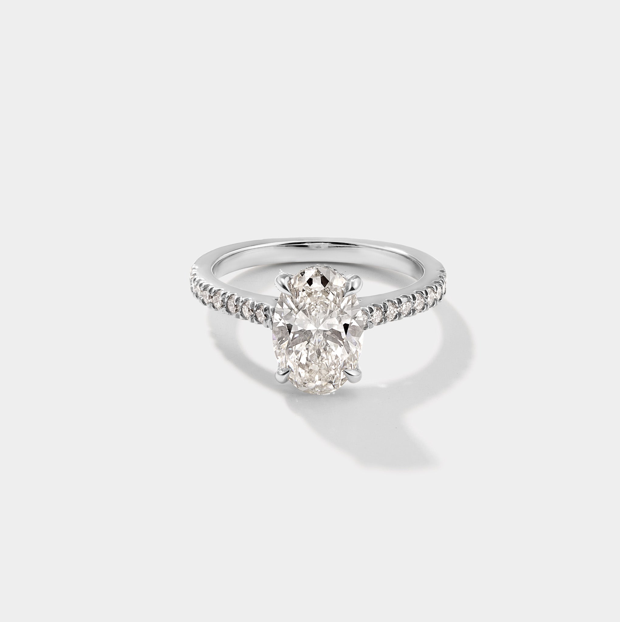 Oval cathedral halo lab-grown diamond engagement ring in 14K white gold by Cove Fine Jewelry