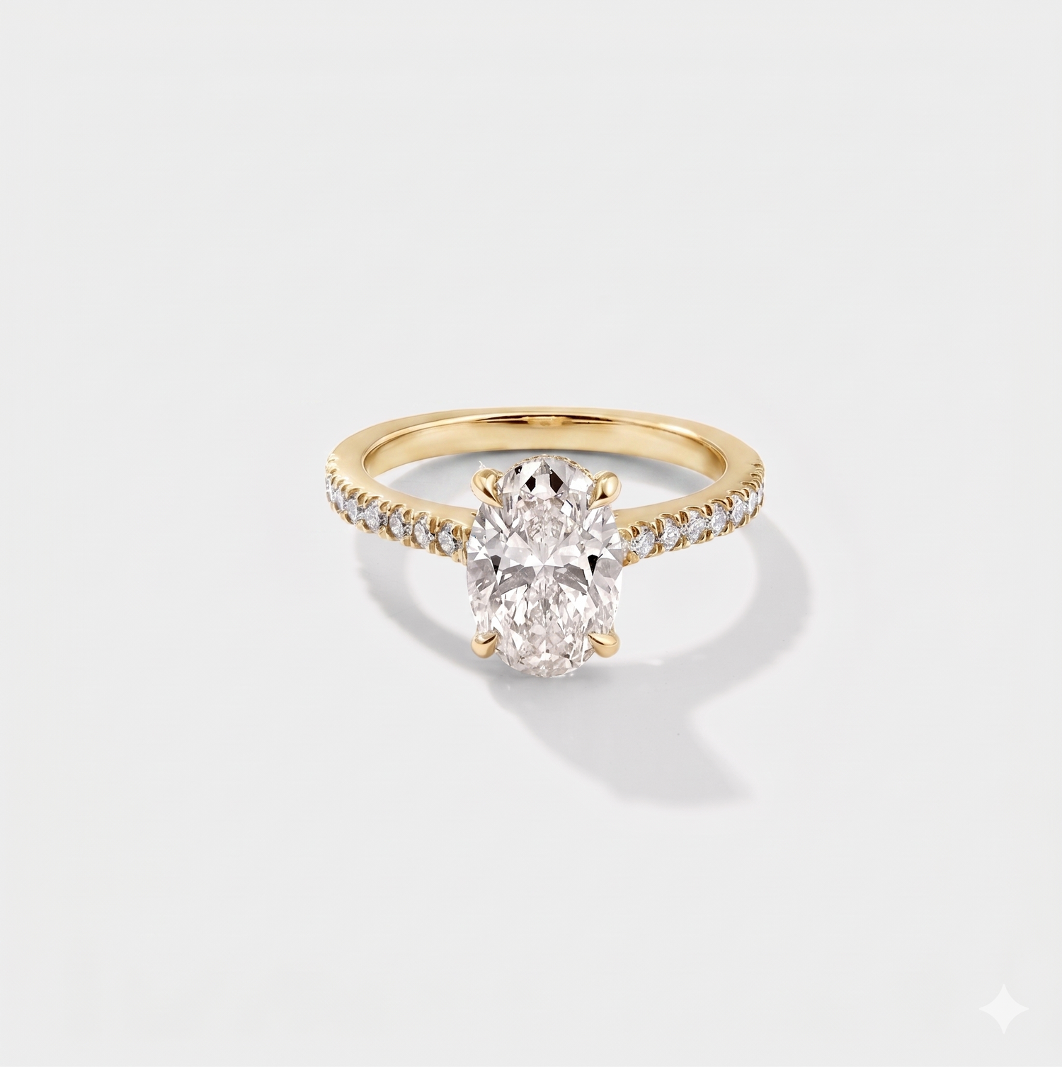 Oval cathedral halo lab-grown diamond engagement ring in 14K yellow gold by Cove Fine Jewelry