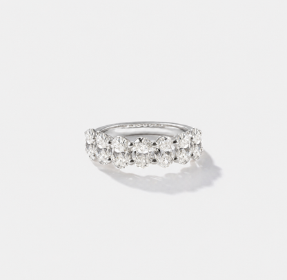 Oval-cut lab-grown diamond eternity band with shared prongs in polished white gold.