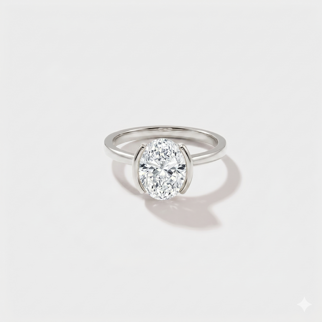 Side profile of oval bezel band solitaire engagement ring with lab-grown diamond