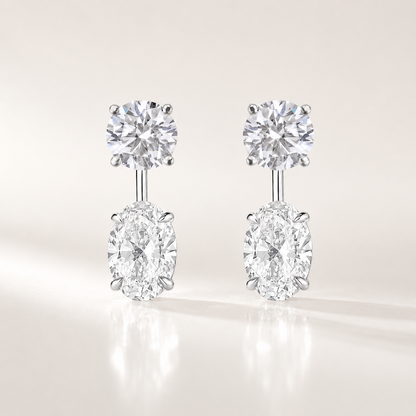 Ebb &amp; Flow lab-grown diamond earring jacket with a round diamond stud and oval diamond dangle in white gold.