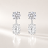 Ebb & Flow lab-grown diamond earring jacket with a round diamond stud and oval diamond dangle in white gold.