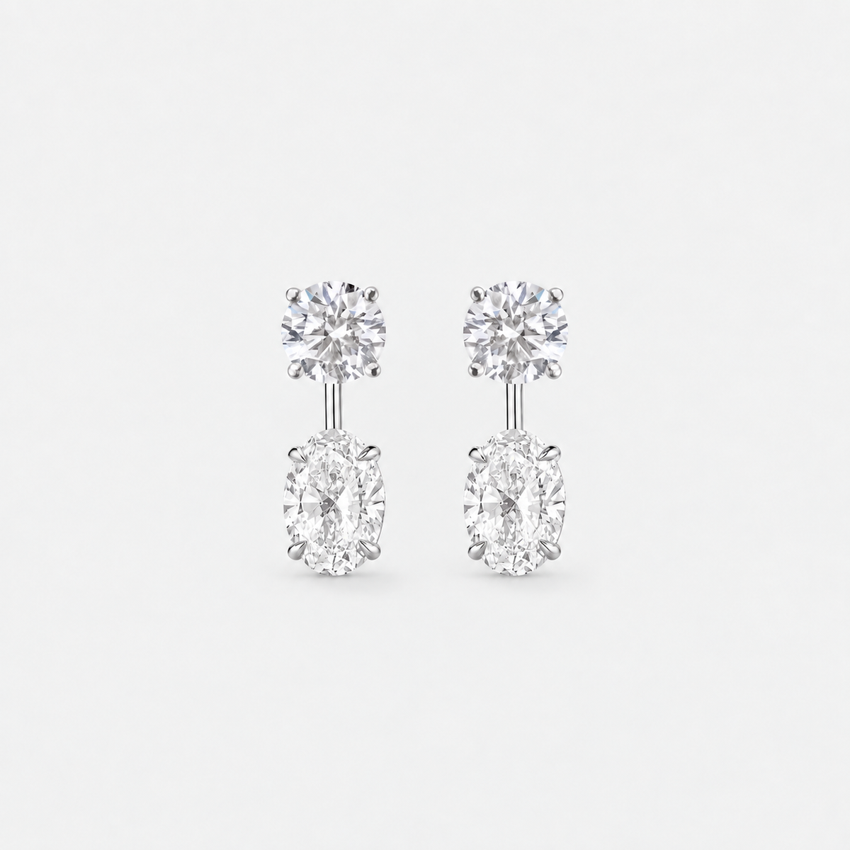 Round lab-grown diamond studs with oval lab-grown diamond earring jackets in polished white gold.