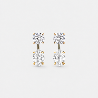 Round lab-grown diamond studs paired with oval lab-grown diamond earring jackets in 14k yellow gold.