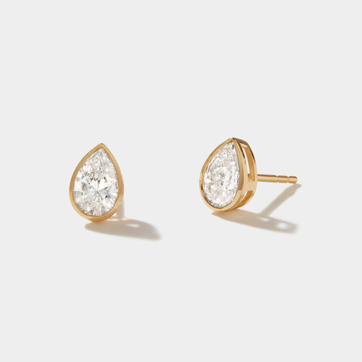 Pear-shaped lab-grown diamond bezel stud earrings in 14k yellow gold