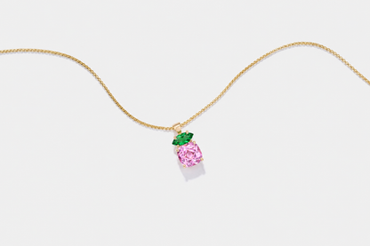 Pink sapphire and emerald fine jewelry designed for breast cancer awareness and fundraising events.