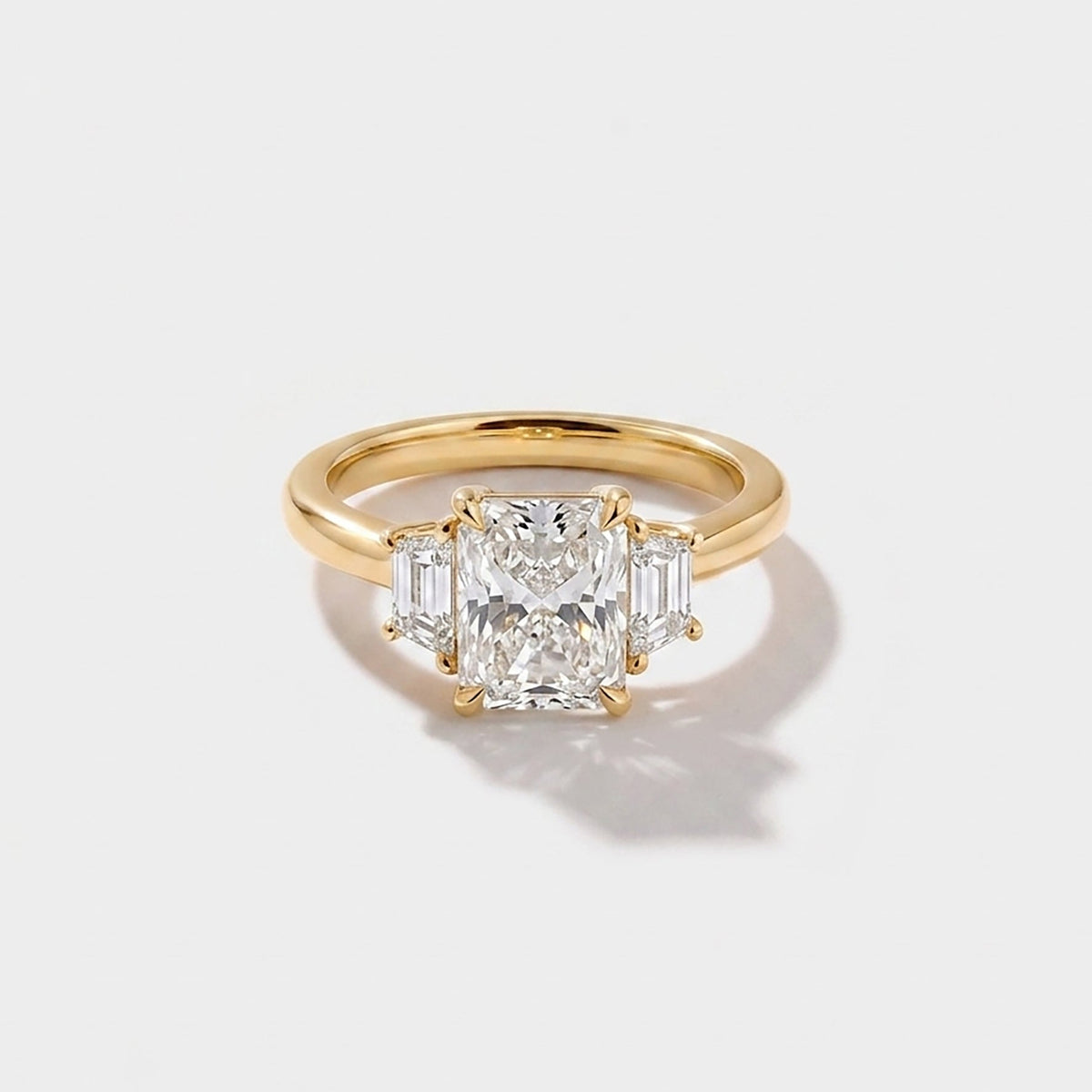 A radiant three stone engagement Ring