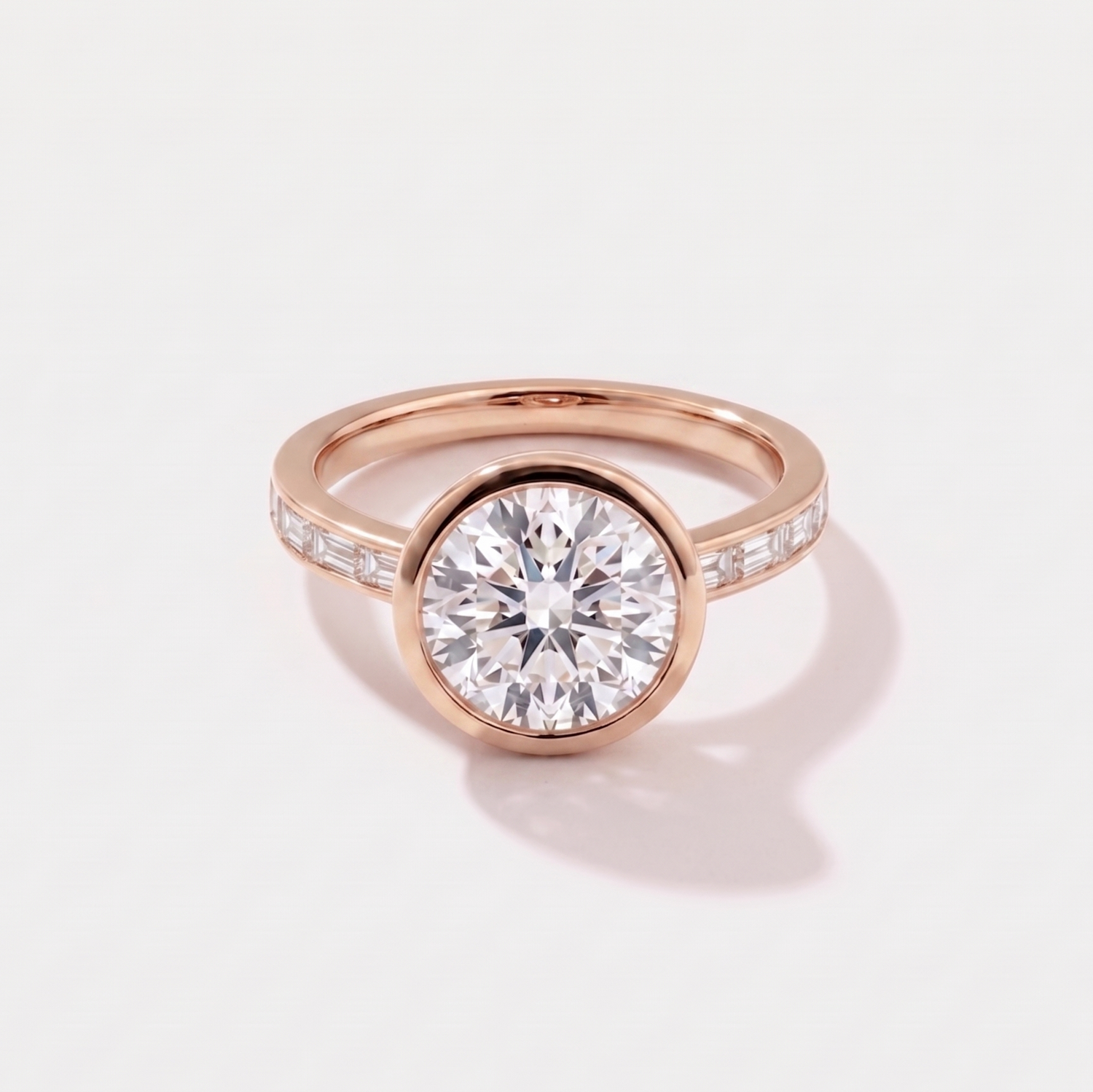 Round channel set solitaire lab-grown diamond engagement ring in 14K rose gold by Cove Fine Jewelry