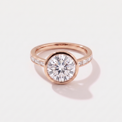 Round channel set solitaire lab-grown diamond engagement ring in 14K rose gold by Cove Fine Jewelry