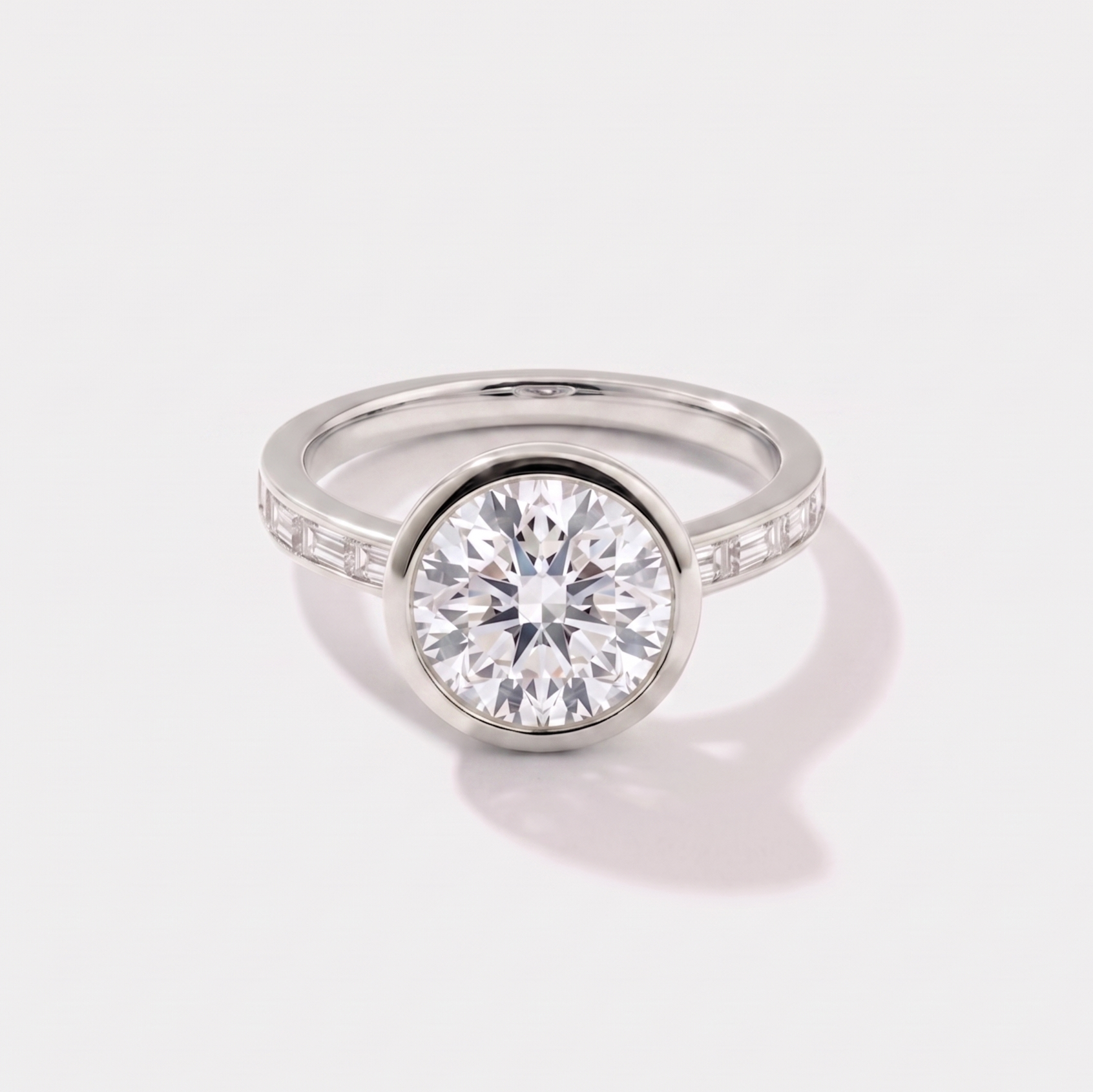 Round channel set solitaire lab-grown diamond engagement ring in 14K white gold by Cove Fine Jewelry