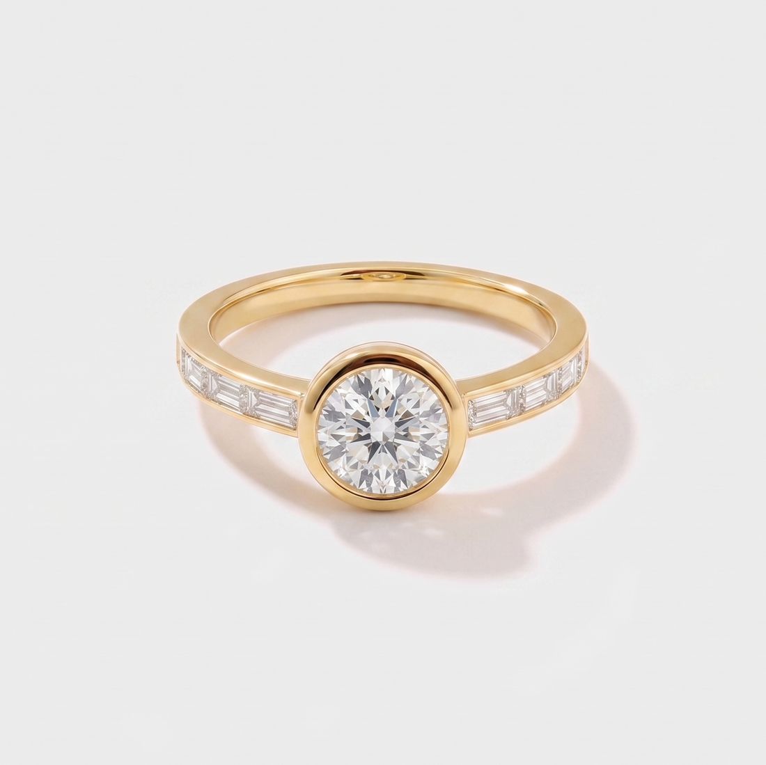 Round channel set solitaire lab-grown diamond engagement ring in 14K yellow gold by Cove Fine Jewelry