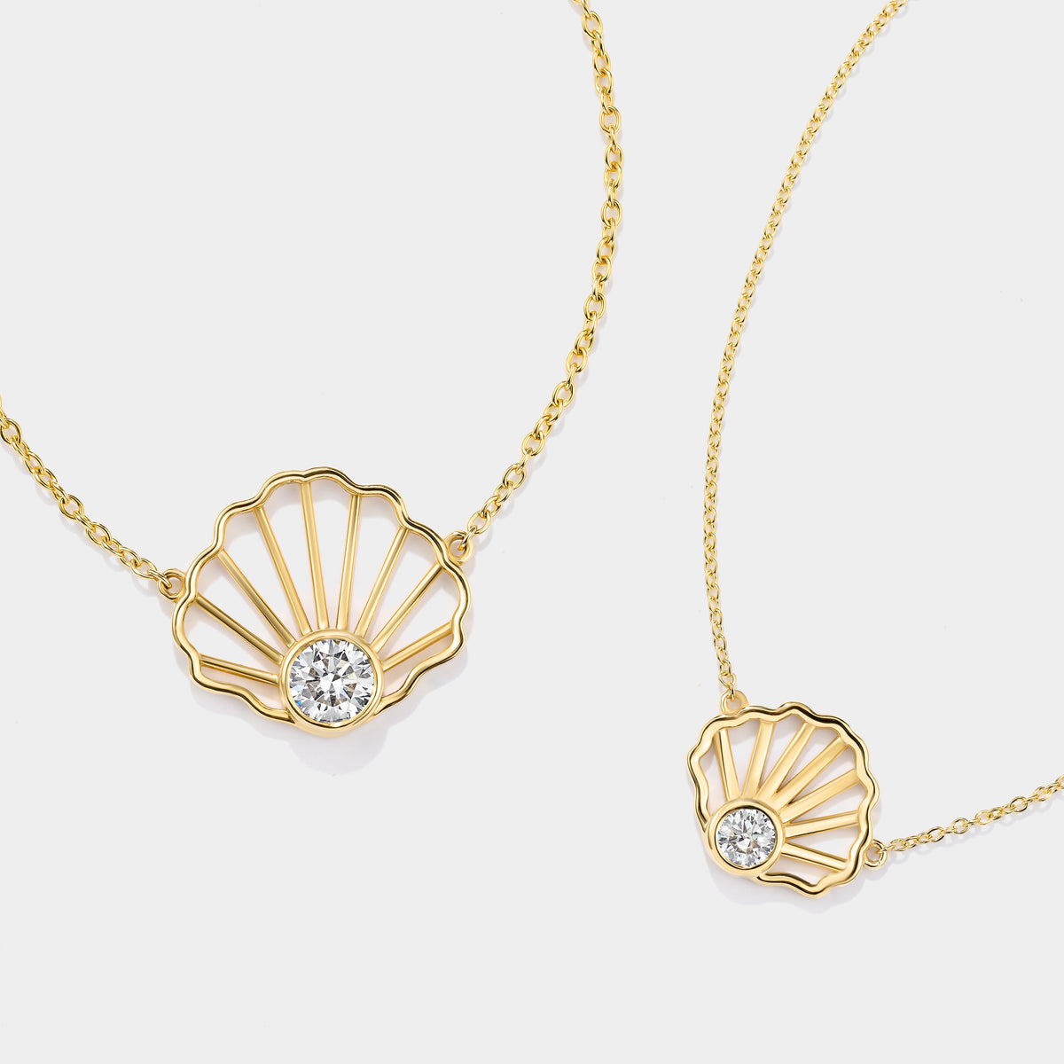 Cape Cod-inspired scallop shell diamond necklace handcrafted in solid 14K gold by Cove Fine Jewelry.
