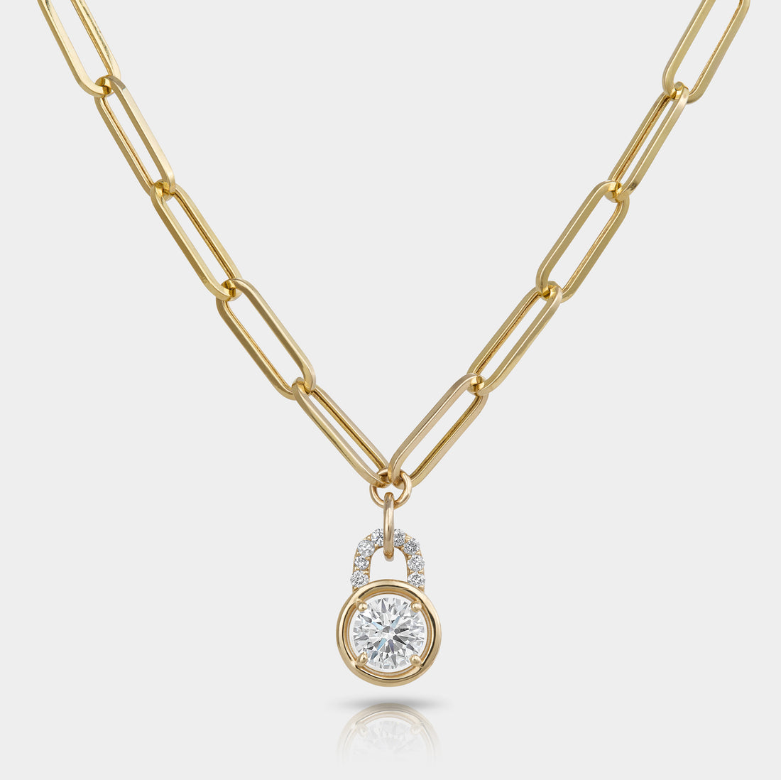 A pendant that looks like a locket on a paperclip chain. 