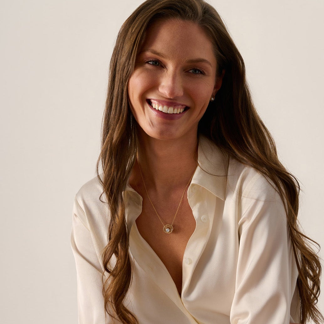 14K solid gold oyster shell diamond necklace inspired by the oyster flats of Wellfleet, Cape Cod.